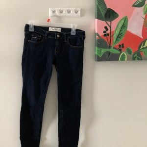 hollister dark wash low rise skinny jeans.